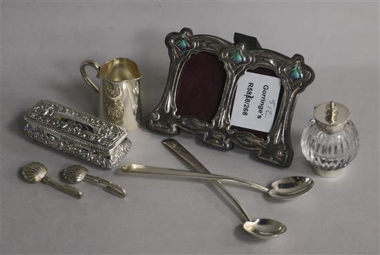 An early 20th century Art Nouveau sterling silver and enamel(a.f.) double photograph frame and other items.